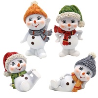 Dekohelden24 Schneekinder mit Mütze und Schal in grün, orange,